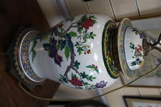 A pair of large Chinese famille rose baluster jars and covers, late 19th / early 20th century, 80.5cm to top of brass fittings